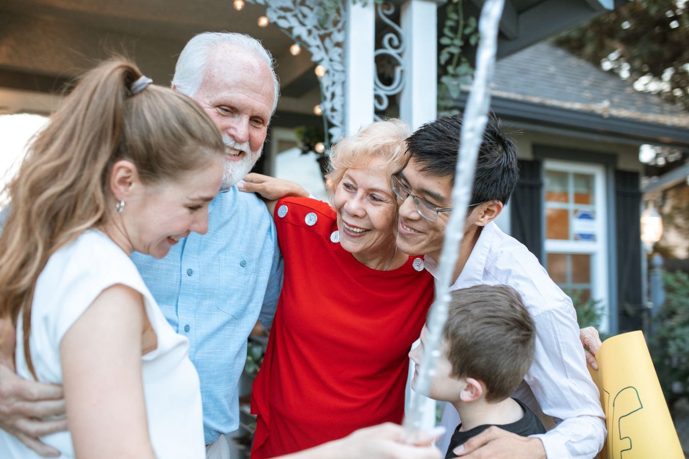 Three generations of a family embracing outdoors